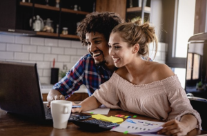 young couple reviewing credit score boost after authorized user tradelines post